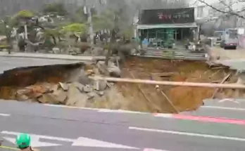 Motorcyclist dies after massive sink hole opens up in middle of the road prompting 18 hour search